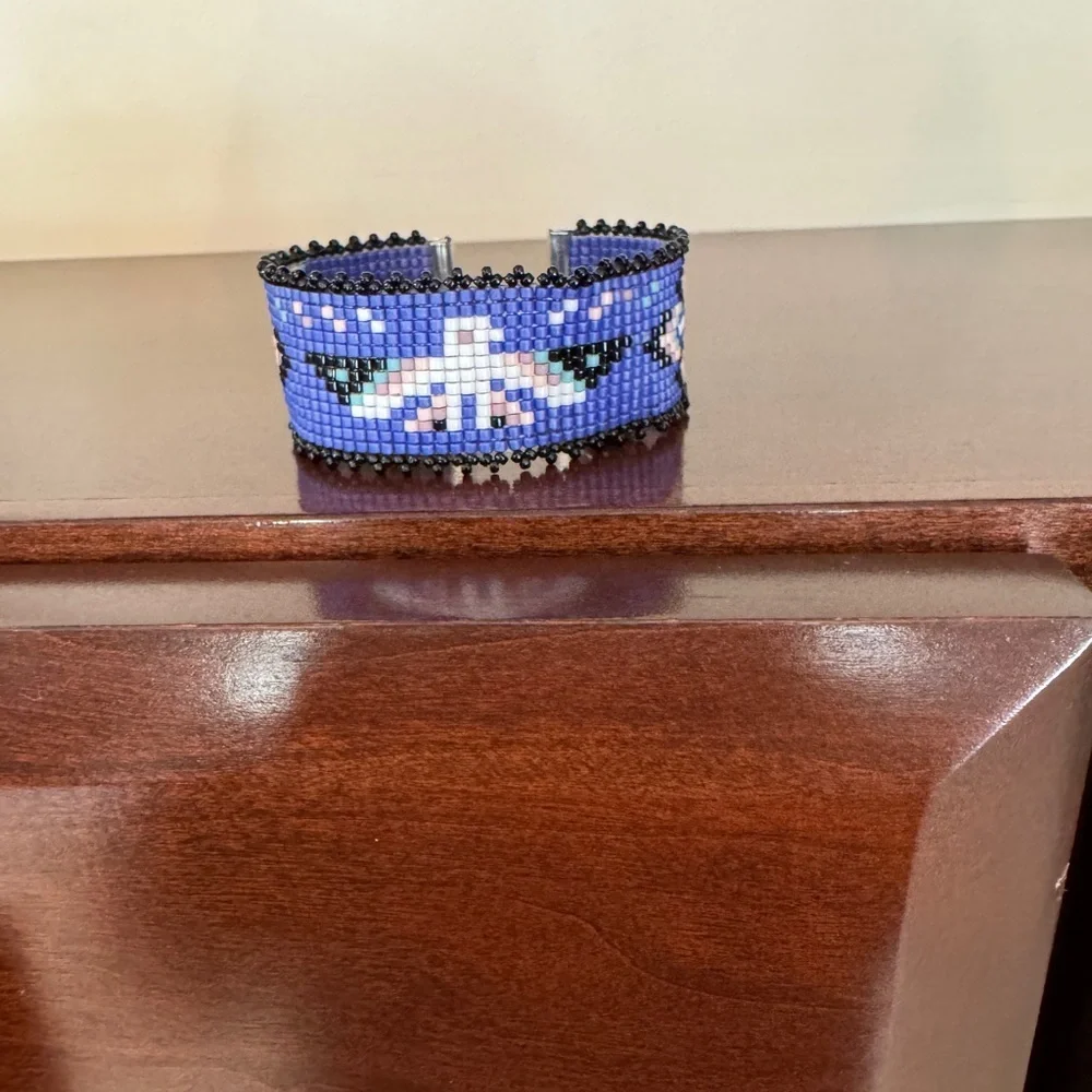 Hand crafted Adjustable Beaded Bracelet with Thunderbird and charms